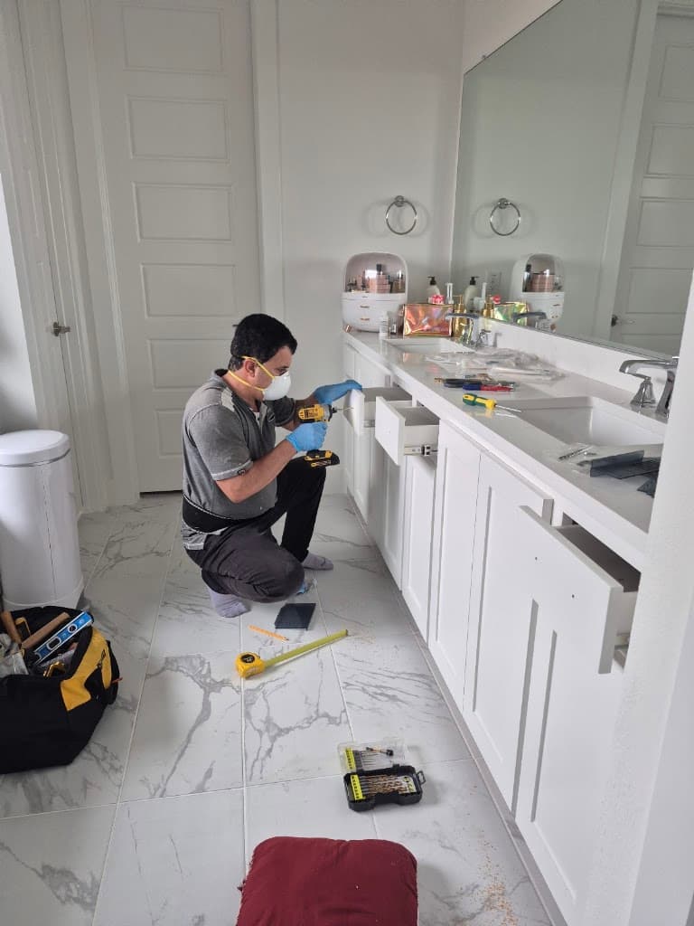 Handyman installing a bathroom vanity